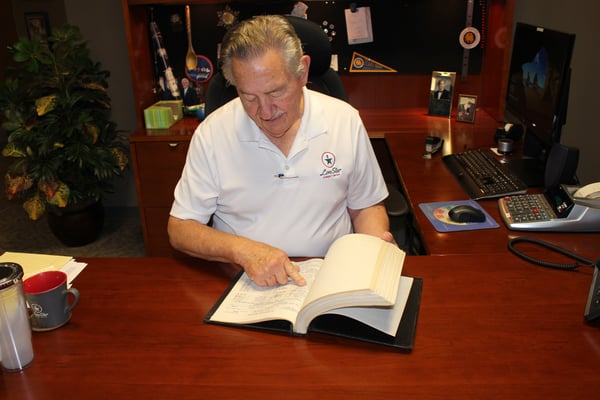 Man reading a book at a desk